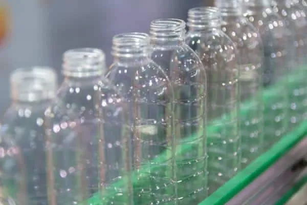 Plastic water bottles on an assembly line