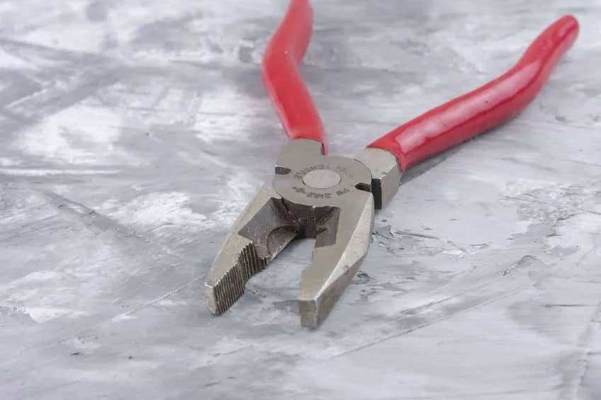 Pliers with plastisol dip coating